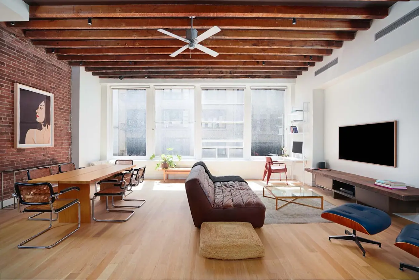 South-facing living room with city views and exposed timber beams