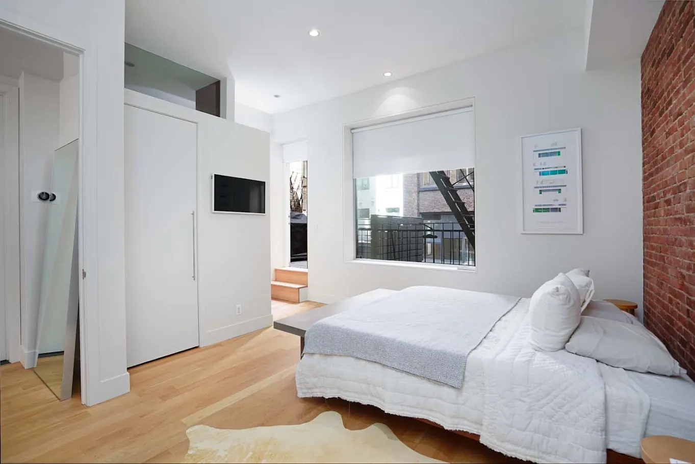 Bedroom with brick wall